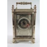 A Mappin & Webb Silver Carriage Clock with twin fusee striking movement. The silver case with chased