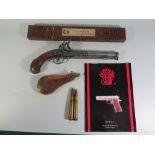 A Dixon & Son Copper Powder Flask, Webley Gun Cleaning Kit, reproduction ornamental flintlock