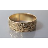 A Decorative 9ct Gold Wedding Band, size T.5, 2.6 g