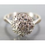 An 18ct White Gold and Diamond Cluster Ring, size N, 3.7 g