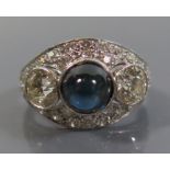 A Platinum Cabochon Sapphire and Diamond Ring, diamonds c. .7ct, size M.5, 6.2g