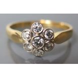 An 18ct Gold .55 ct Diamond Cluster Ring, size T, 4.2 g