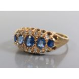 An 18ct Gold Sapphire and Diamond Ring, 1919, size R, 3.7g