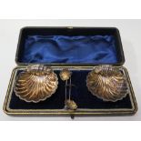 A Cased Set of Victorian Silver Scallop Shaped Salts with spoons, Chester 1894, Cornelius Saunders &