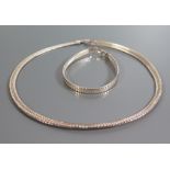 A Cased Silver Necklace with matching bracelet and two other bracelets