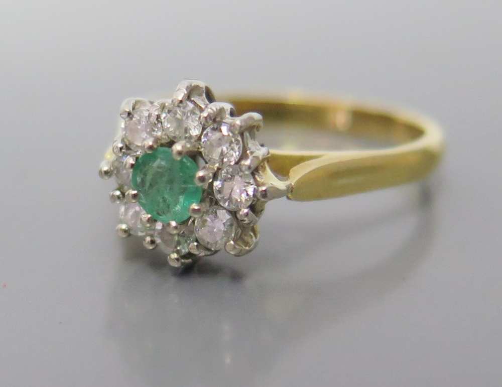 An 18ct Gold Emerald and Diamond Ring, size M, 3.2g