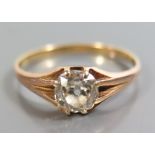 A Diamond Solitaire, c. .8ct in precious yellow metal setting