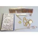 An Elizabeth II Silver Mounted Notebook decorated with cherubs, silver mounted comb, silver and