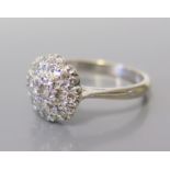 An 18ct White Gold and Diamond Cluster Ring, size N, 3.7 g