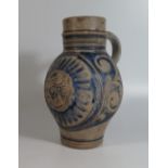 A Westerwald Pottery Jug with incised decoration and initials GR, 23cm