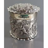 A Victorian Silver Pot with embossed continuous scene of Putti and ribbons and flowers to the lid,