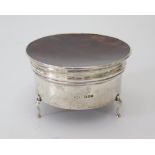A George V Silver Ring Box with tortoise shell set hinged lid, London 1919, C&A, 10cm diam. 211g