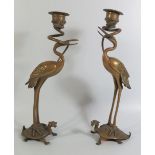 A Pair of Nineteenth Century Chinese Bronze Candlesticks in the form of storks standing on the backs