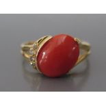 An 18ct Gold, Coral and Diamond Ring, size P, 4.2g