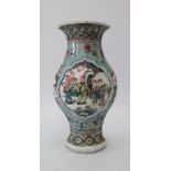 A Chinese Famille Verte Vase decorated with figures, 25cm