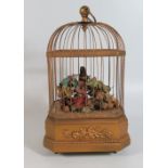 An Automaton Singing Bird in cage, 27cm, in good working order