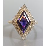 An 18ct Amethyst and Diamond Dress Ring, size L.5, 4.3g