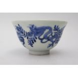 An Eighteenth Century Chinese Blue and White Bowl decorated with dragons, six character marl to