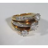 A Three Shank Diamond Ring with three principal stones (ETD 1.8ct), size N.5, 19.8g