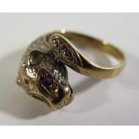 A 9ct Gold Panther Ring with ruby set eyes, size O, 4.7g