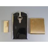 An Art Deco Black Enamel Combination Cigarette Case Lighter, one other lighter and Stratton compact