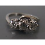 An 18ct White Gold and Diamond Three Stone Crossover Ring, est. 1.5ct, size M, 5.2g