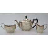 A George V Silver Bachelor's Tea Set with chased and pricked ribbon and swag decoration, Sheffield