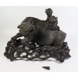 A Nineteenth Chinese Carving of a Recumbent Water Buffalo with laughing figure on back and on a