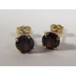 A Pair of 9ct Gold and Garnet Stud Earrings
