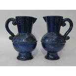 A Pair of Clay Pits Ewenny Pottery Jugs with presentation inscriptions, 27cm, old staple repairs