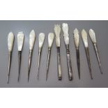 A Collection of Nineteenth Century Mother of Pearl Handled Tweezers etc
