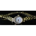 A Rotary Ladies 9ct Gold and Diamond Set Quartz Wristwatch, boxed and with receipt dated 17.07.92,