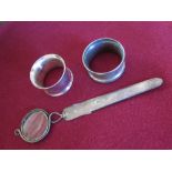 An Edward VII Silver Combination Magnifying Glass Paper Knife and two napkin rings