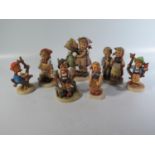 A Collection of Seven Hummel Figurines
