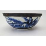 An Eighteenth Century Chinese Blue and White Bowl decorated with figures and landscape within,