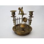 A Nineteenth Century Brass Novelty Twin Candle Inkwell with putto finial, 19.5cm