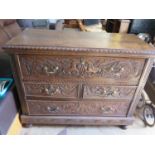 An Eighteenth Century Carved Oak Secretaire Chest