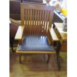 A Miles Carter Oak Slat Back Open Armchair