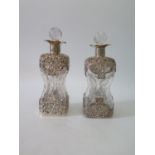 A Pair of Victorian Decanters of Waisted Form with silver mounts, London 1896, W.C