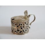 A Victorian Silver Mustard Pot with pierced foliate and cherub decoration, London 1895