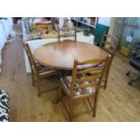 An Ercol Dining Table and Four Chairs