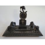 An Indian Ebony Desk Stand with elephant finials