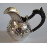 .800 Continental Silver Creamer with repousse scroll and fruit decoration, 70g gross