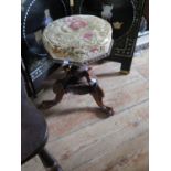 A Victorian Carved Walnut Piano Stool