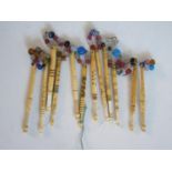 Four Nineteenth Century Named Bone Lace Maker's Bobbins with glass spangles and eight other bone