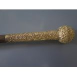 A Victorian 18ct Gold Mounted Cane with foliate scroll decoration