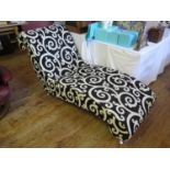 A Contemporary Chaise Longue with stylised foliate scroll black and white upholstery