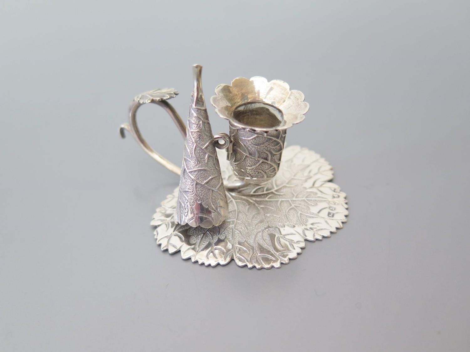 A George III Silver Miniature Chamberstick of leaf form, London 1829, JW, 29g, 55 mm base