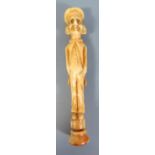 An Antique Ivory Pipe Tamper with screw base for cleaner and in the form of a man with hands in