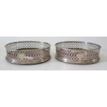 A Pair of George III Silver Wine Coasters with pierced aprons and armorial of winged Crescent with